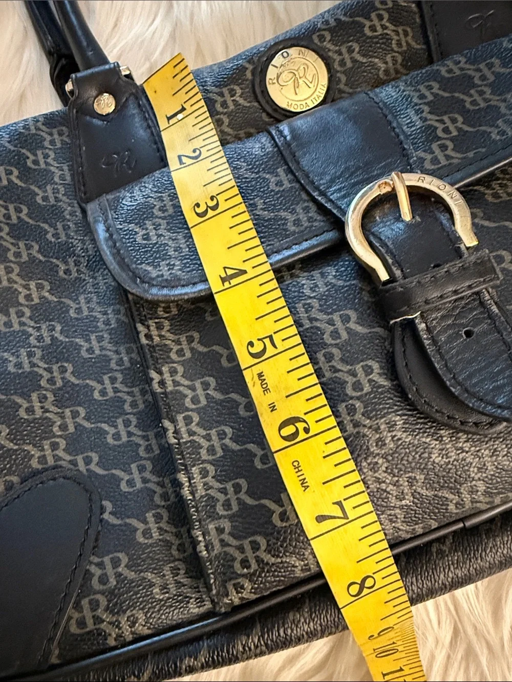 Rioni Signature Organizer Satchel featuring a black monogram 